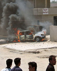 A group of Iraqi men stand in front of Khalidiya police station