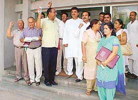 BJP and Congress councillors, led by MLA Chander Mohan, stage a walkout from the MC House 