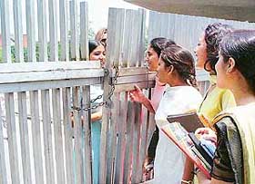 Panjab University students interact on Thursday over the gate opposite the PGI 