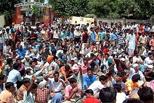 Students of Rajindra Government College and other colleges block traffic on the Bathinda-Mansa road on Thursday to protest the failure of the Punjab Government to redress their grievances.