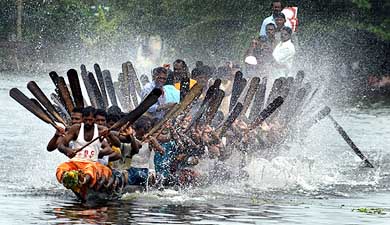 Rowers paddle their boat in the Vembanad lake while practicing for the  Snake Boat Race