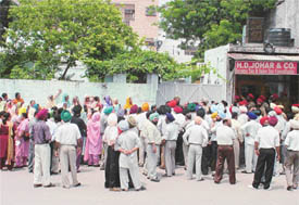 Teachers protest in front of the residence of Education Minister Harnam Dass Johar
