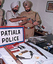 Patiala SSP P.S. Umarangal inspects arms recovered from the Pardi Gang