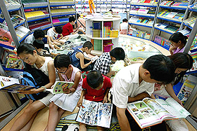 Chinese youths read at a book store in Beijing on Wednesday