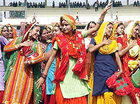 Students perform 'Giddha Dance' while rehearsing for the Independence Day celebration at the Guru Nanak Stadium in Amritsar 