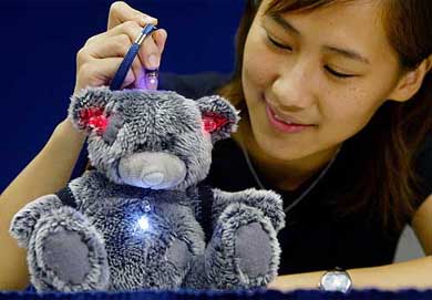 A student of Hong Kong University of Science & Technology demonstrates the functioning of a UV Bear