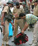 The police checks the bag of a tourist