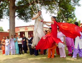 Girls of Khalsa College for Women enjoy a swing