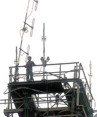 Bhaskar Bora, a casual news reader of AIR, threatens to jump from the tower