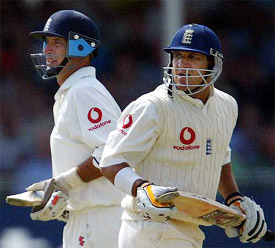 Englands Nasser Hussain and Mark Butcher take a run on the first day of the third Test match against South Africa