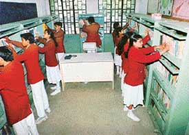 Students browsing at the school library