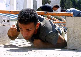 A Palestinian Special Police Force member trains in the West Bank city of Qalqilyah 