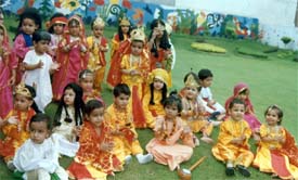 Dressed like Krishna, Radha, Meera and Sudama, students of Mothers Touch Play School wait to participate in a Janmashtmi function