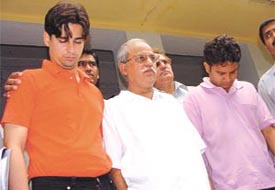The father-son duo and their accomplice