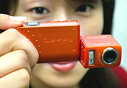 A Sony employee shows off the company's new two mega pixel digital camera