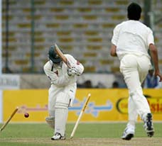 Bangladeshi batsman Javed Omar Belim is bowled by Pakistani fast bowler pacer Omar Gul
