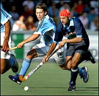 India's Prabhjot Singh takes the ball away from Argentina's Fernando Zylberberg during their Champions Trophy match 