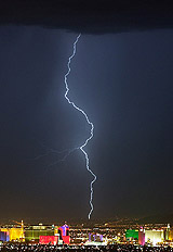 A bolt of lightning strikes east of hotels and casinos