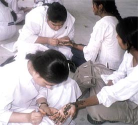 Students at a mehendi designing inter-school festival organised at the Air Force Auditorium