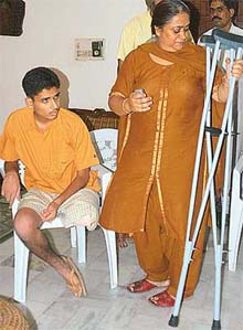 A weeping Mrs Anuradha Ahluwalia giving details of her sons case, Abhishek, whose leg had to be amputated after a simple fracture at her residence in Manimajra