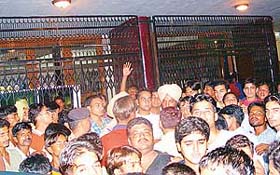 Cinegoers protest outside Neelam Cinema against the poor quality of sound during the screening of Mumbai Se Aaya Mera Dost on Friday night