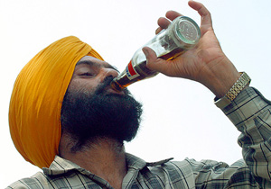 A man drinks a Pepsi soft drink