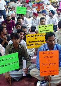 Members of the Punjab and Chandigarh College Teachers Union protest outside the Deputy Commissioners office in Ludhiana