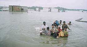 Residents of the Boara Banda area in Hyderabad moving to a highland