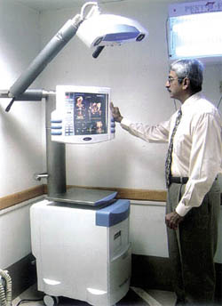 Dr C.J.Thakkar operating a surgical navigation system for hip and knee replacement