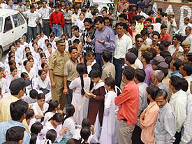 Deputy Commissioner Bharat Khera pacifies students outside his office in Solan on Monday.