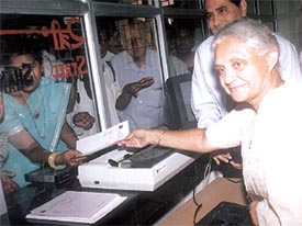 Delhi Chief Minister Sheila Dikshit handing over the first OPD ticket after the opening of Satyawadi Raja Harish Chandra Hospital at Narela