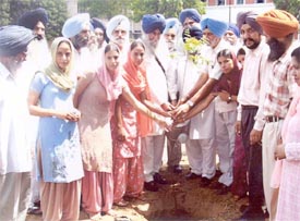 Mr Simranjit Singh Mann, MP, plants a neem sapling at a vanmahotsava function organised by GHG Khalsa College