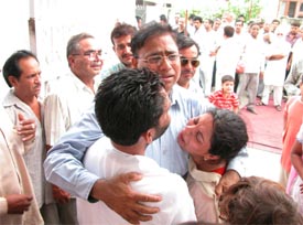 Family members of fire victims mourn at their residence at BRS Nagar