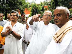 Former Prime Ministers V.P. Singh, H.D. Deve Gowda and senior CPM leader Sita Ram Yechuri during a demonstration against the World Trade Organisation in New Delhi on Tuesday