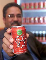 Mecca Cola inventor Tawfiq Mathluthi shows his product in Dubai 