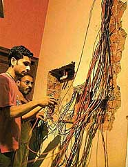 The entire wiring of a house in Sector 36 which got burnt due to excessive voltage being replaced in Chandigarh on Wednesday.