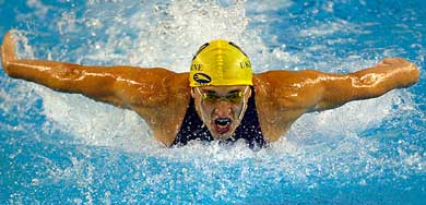 Ukraine's Audriy Serdinov swims during the men's 100m butterfly final 