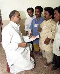 Opposition leader of Andhra Pradesh state assembly Dr Y. S. Rajsekhar Reddy receives a memorandum from a group of dwarfs