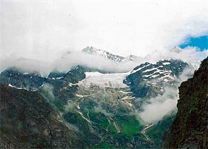 Clouds play hide and seek with the peaks, adding to the mystique of the trek to Hemkunt Sahib