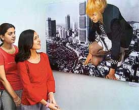Visitors admire an exhibit by French photographer Margane Le Gall displayed at an exhibition organised at the Fine Arts Museum