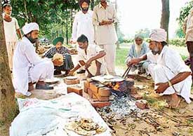 By setting up their temporary kitchens outside the Sector 16 Zakir Rose Garden in Chandigarh on Monday