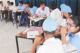 Students participate in a quiz contest held at Ajit Karam Singh International Public School, Sector 41