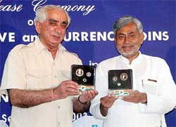 Union Finance Minister Jaswant Singh and Railway Minister Nitish Kumar release a set of hundred rupee commemorative coins 