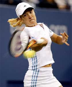 Justine Henin-Hardenne of Belgium hits a return to Dinara Safina of Russia