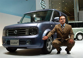 Nissan Motor Co President and CEO Carlos Ghosn poses with the new three-row Cube Cubic car in Tokyo 