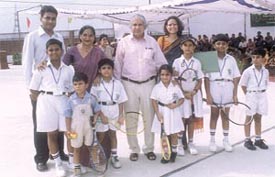 Chairman of the DPS Society Narendra Kumar and DPS, Indirapuram, principal Mita Rai with young players after the inauguration of a tennis centre at DPS
