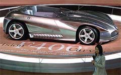 A visitor walks past a Mercedes Benz concept car F400 