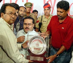 Former Indian cricket captain Kapil Dev being honoured at a function in Ambala