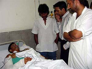 Dhanraj Pillay, captain of the Indian hockey team, with injured hockey star Jugraj Singh