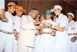 The President signs autographs for schoolchildren